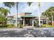 Community center entrance with lush landscaping at 1018 Caravel Ct, Tarpon Springs, FL 34689