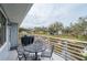 Relaxing deck with seating area and canal views at 1018 Caravel Ct, Tarpon Springs, FL 34689