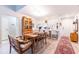 Open concept dining area with kitchen view, wooden table, and seating at 1018 Caravel Ct, Tarpon Springs, FL 34689