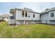 House exterior with deck and canal view at 1018 Caravel Ct, Tarpon Springs, FL 34689