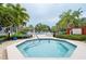 Community hot tub near pool and lounge area at 1018 Caravel Ct, Tarpon Springs, FL 34689