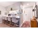 Kitchen with breakfast bar, white cabinets, and modern appliances at 1018 Caravel Ct, Tarpon Springs, FL 34689