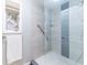 Walk-in shower with modern gray tile and glass enclosure at 1018 Caravel Ct, Tarpon Springs, FL 34689