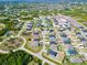 Aerial view of the house and surrounding neighborhood at 105 Oakwood Ct, Rotonda West, FL 33947