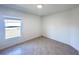 Bedroom with tile floor and window overlooking backyard at 105 Oakwood Ct, Rotonda West, FL 33947