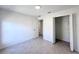 Well-lit bedroom featuring tile floors and a closet at 105 Oakwood Ct, Rotonda West, FL 33947