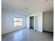 Bedroom with tile floors, window, and closet at 105 Oakwood Ct, Rotonda West, FL 33947