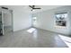 Light and airy bedroom with tile flooring and ample natural light at 105 Oakwood Ct, Rotonda West, FL 33947