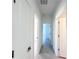 Bright hallway with doors leading to other rooms at 105 Oakwood Ct, Rotonda West, FL 33947