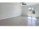 Bright living room with tile flooring and sliding glass doors at 105 Oakwood Ct, Rotonda West, FL 33947