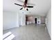 Open living room showcasing tile floors and views into kitchen and dining areas at 105 Oakwood Ct, Rotonda West, FL 33947