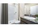 Clean bathroom with a shower/tub combo and granite vanity at 10550 Bridgegate Heights Loop, San Antonio, FL 33576