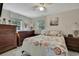 Guest bedroom with seashell bedding and ample dresser storage at 10581 Pine Island Dr, Weeki Wachee, FL 34607