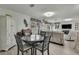 Bright dining area with table and chairs near living room at 10581 Pine Island Dr, Weeki Wachee, FL 34607