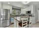 Modern kitchen featuring granite countertops and stainless steel appliances at 10581 Pine Island Dr, Weeki Wachee, FL 34607