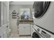 Laundry room with a Samsung washer and dryer, plus a granite countertop at 10581 Pine Island Dr, Weeki Wachee, FL 34607