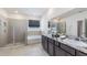 Double vanity bathroom with walk-in shower and soaking tub at 10633 Bridgegate Heights Loop, San Antonio, FL 33576