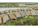 Aerial view of houses and community with lake at 10804 Wicker Park Pl, Palmetto, FL 34221