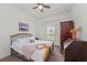 Bright bedroom with a comfortable bed and ample closet space at 10804 Wicker Park Pl, Palmetto, FL 34221