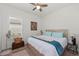 Comfortable guest bedroom with wood flooring and ceiling fan at 10804 Wicker Park Pl, Palmetto, FL 34221