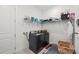 Convenient laundry room with washer, dryer, and shelving at 10804 Wicker Park Pl, Palmetto, FL 34221