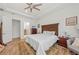 Spacious main bedroom with wood furniture and ensuite bathroom access at 10804 Wicker Park Pl, Palmetto, FL 34221