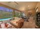 Outdoor kitchen and seating area overlooking a refreshing pool at 10804 Wicker Park Pl, Palmetto, FL 34221