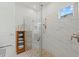 Spa-like shower with marble tile and glass enclosure at 10804 Wicker Park Pl, Palmetto, FL 34221