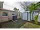 Backyard view showing a shed and AC unit at 10821 Freedom Blvd, Seminole, FL 33772