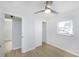 Bedroom with ceiling fan, closet, and window at 10821 Freedom Blvd, Seminole, FL 33772