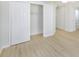 Simple bedroom with light flooring and a double door closet at 10821 Freedom Blvd, Seminole, FL 33772