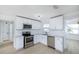 Renovated kitchen, white cabinets, stainless steel appliances at 10821 Freedom Blvd, Seminole, FL 33772