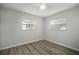 Bright bedroom with wood-look floors and ceiling fan at 1203 Baronwood Pl, Brandon, FL 33510