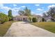 House exterior showcasing landscaping and driveway at 1203 Baronwood Pl, Brandon, FL 33510