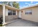 Front porch with two white metal chairs at 1203 Baronwood Pl, Brandon, FL 33510