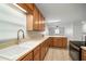 Modern kitchen with white sink and stainless steel appliances at 1203 Baronwood Pl, Brandon, FL 33510