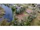 High-angle view of property by the lake with surrounding vegetation at 12914 Gordon Rd, Riverview, FL 33579