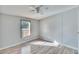 Bright bedroom featuring light gray walls and wood-look flooring at 12914 Gordon Rd, Riverview, FL 33579