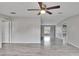 Large living room with gray walls, wood-look vinyl flooring, and ceiling fan at 12914 Gordon Rd, Riverview, FL 33579