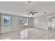 Spacious living room with light gray walls and wood-look floors at 12914 Gordon Rd, Riverview, FL 33579