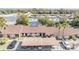 Condo complex with parking and surrounding businesses at 1311 Powderpuff Dr # 4, Dunedin, FL 34698