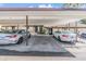 Covered carport with parking spaces for residents at 1311 Powderpuff Dr # 4, Dunedin, FL 34698