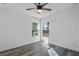 Spacious bedroom featuring large windows and wood-look floors at 13145 Flotilla Ct, Brooksville, FL 34613