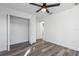 Well-lit bedroom with wood-look floors and ample closet space at 13145 Flotilla Ct, Brooksville, FL 34613