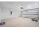 Spacious garage with white walls and an automatic door opener at 13145 Flotilla Ct, Brooksville, FL 34613