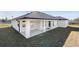 Single story home with covered patio and landscaping at 13145 Flotilla Ct, Brooksville, FL 34613