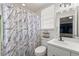 Modern bathroom with a shower/tub combo, toilet, and vanity at 13178 Thrush St, Spring Hill, FL 34609