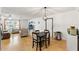 Dining area with four chairs and a view into the living room at 13178 Thrush St, Spring Hill, FL 34609