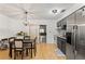 Kitchen with gray cabinets, stainless steel appliances, and sliding glass doors at 13178 Thrush St, Spring Hill, FL 34609