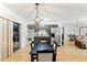 View of kitchen, dining area, and living room with stainless steel appliances at 13178 Thrush St, Spring Hill, FL 34609